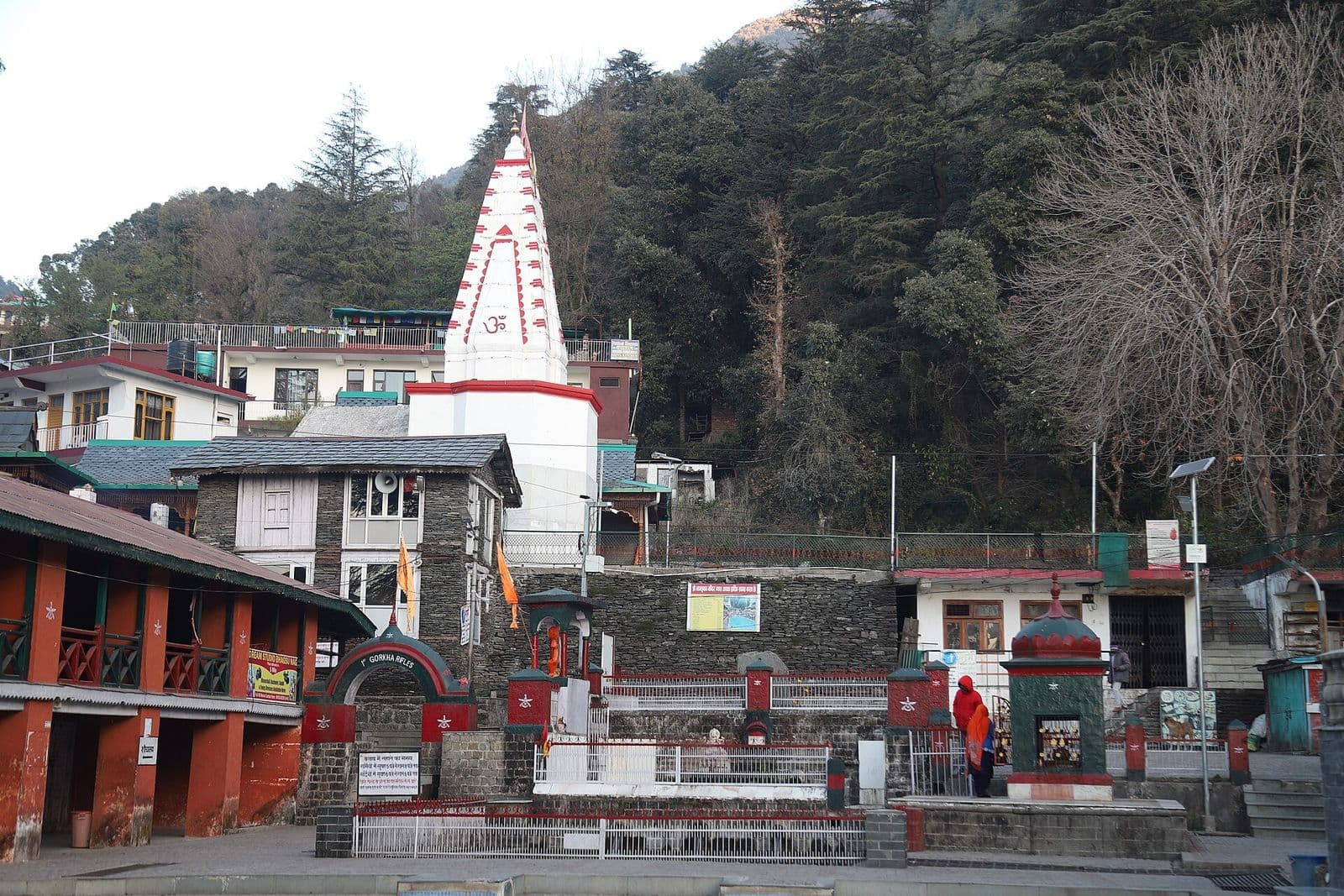 White shikhara spire of the Bhagsunag Temple and its compound in Bhagsu, near McLeod Ganj