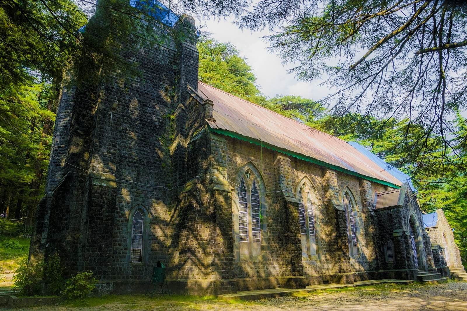 Neo-Gothic stone Church of St. John in the Wilderness among deodar trees near McLeod Ganj