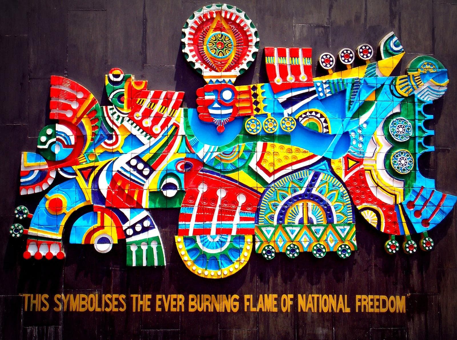 Colourful mural symbolising the eternal flame of national freedom at the Shaheed Smarak war memorial, Dharamshala
