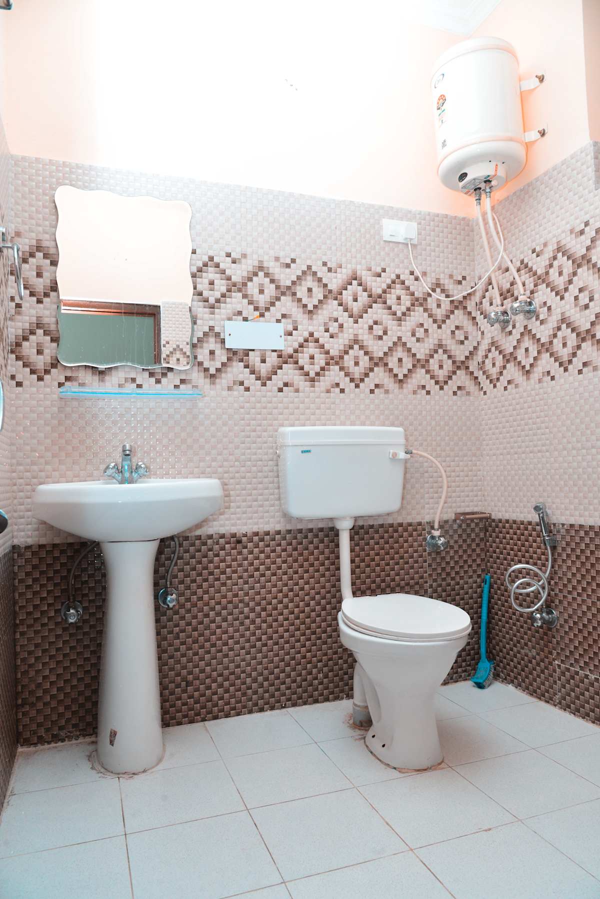 Attached bathroom with water heater at Backpackers Inn, McLeod Ganj