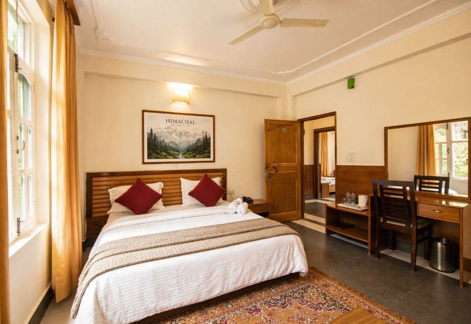 Double room with wooden furniture at The Lodge Dharamkot