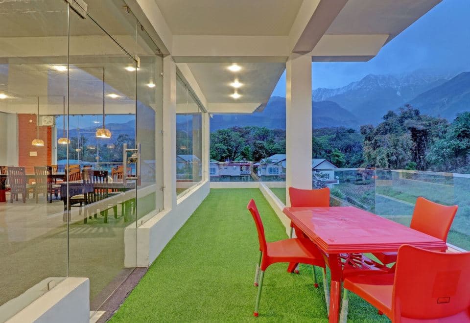 Terrace at Treebo Ortus Residency with Dhauladhar mountain view