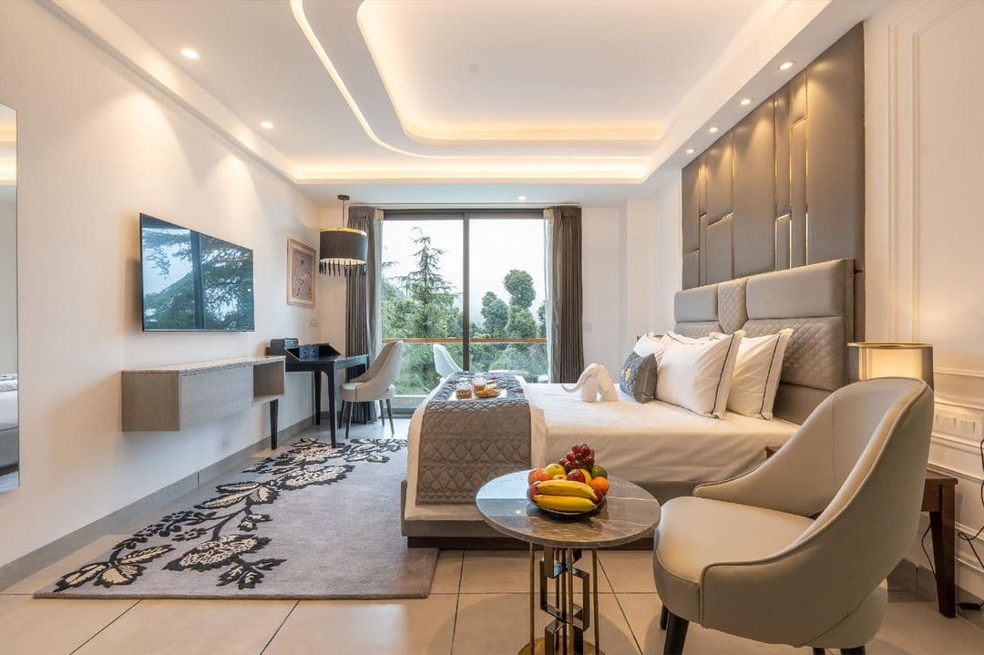 Super deluxe room with forest-facing glass doors at Mastiff Select Mandavya