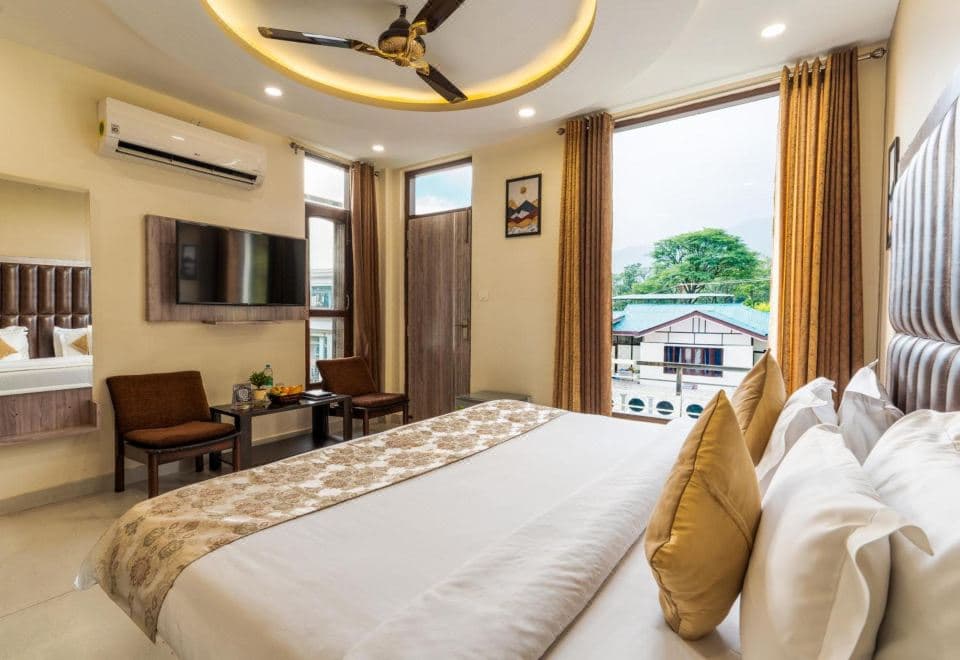 Room with large window at Treebo Ortus Residency