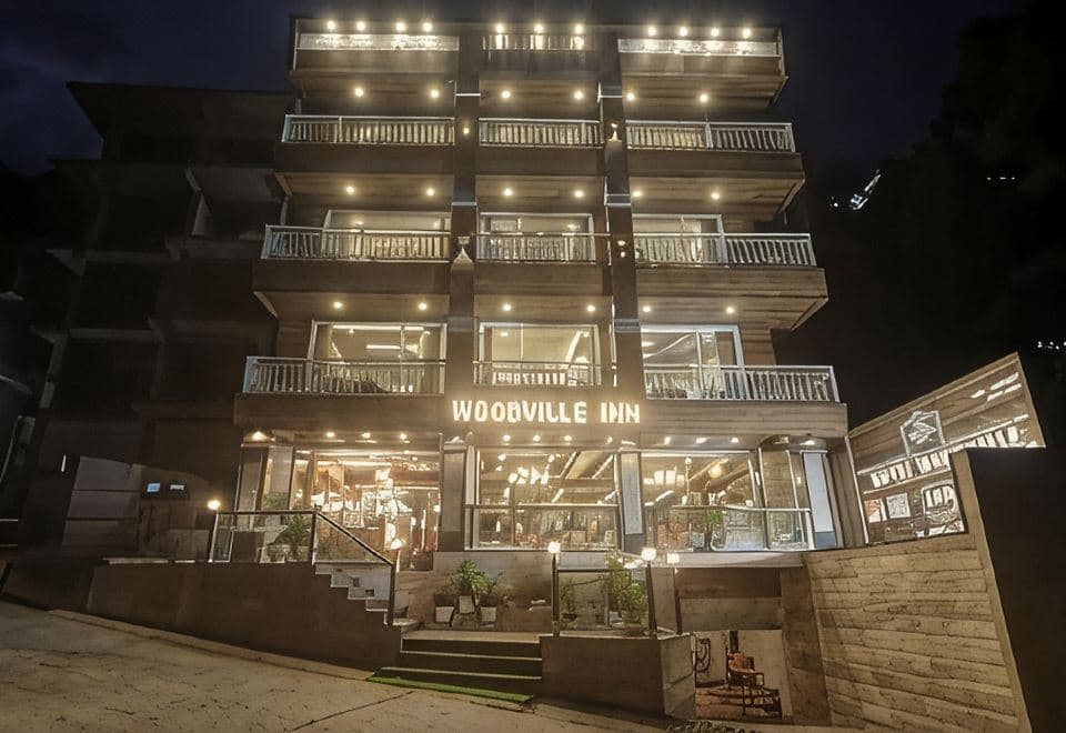 Hotel Woodville Inn lit up at night, near the Dalai Lama Temple in McLeod Ganj