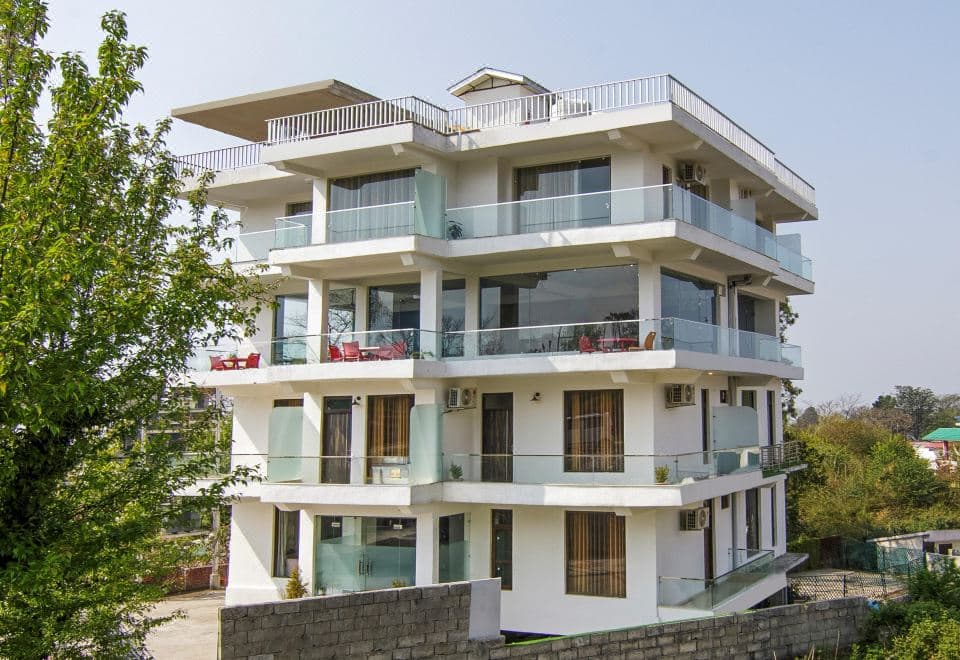 Treebo Ortus Residency white multi-storey building with glass balconies