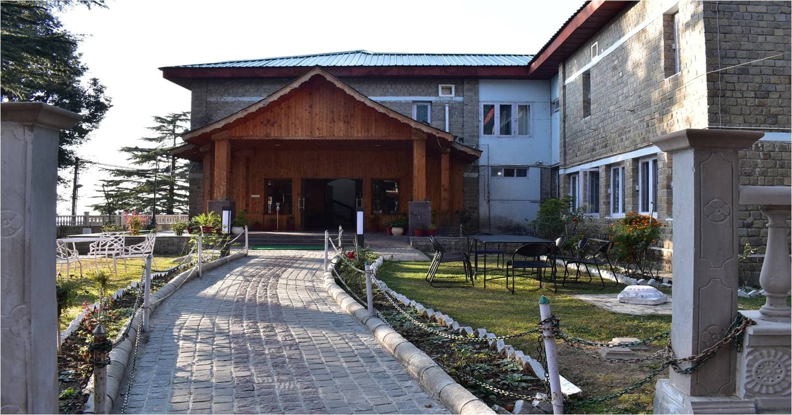 Main building and garden pathway at HPTDC Hotel Bhagsu, McLeod Ganj