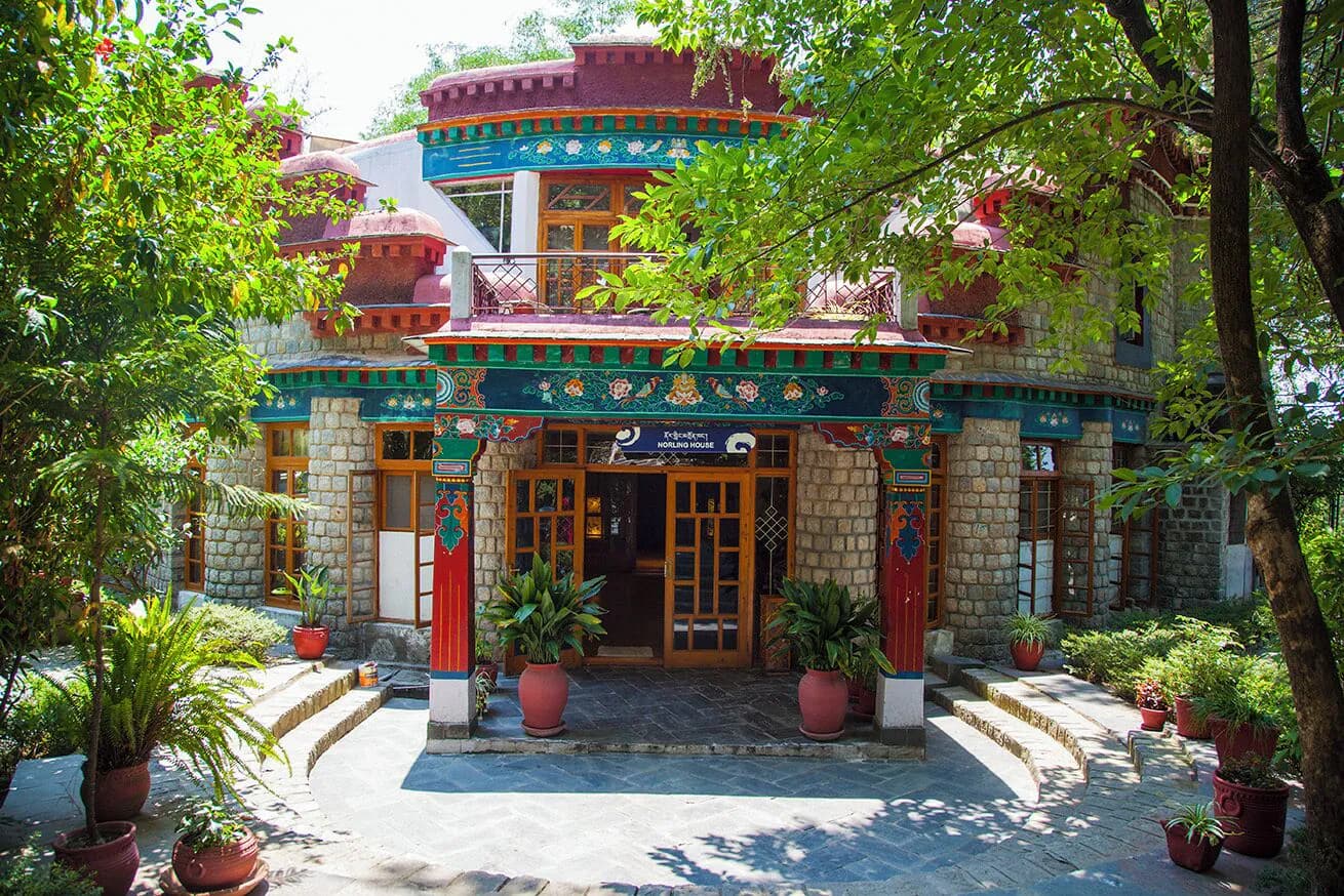 Painted Tibetan-style entrance of Norling House, Norbulingka Institute