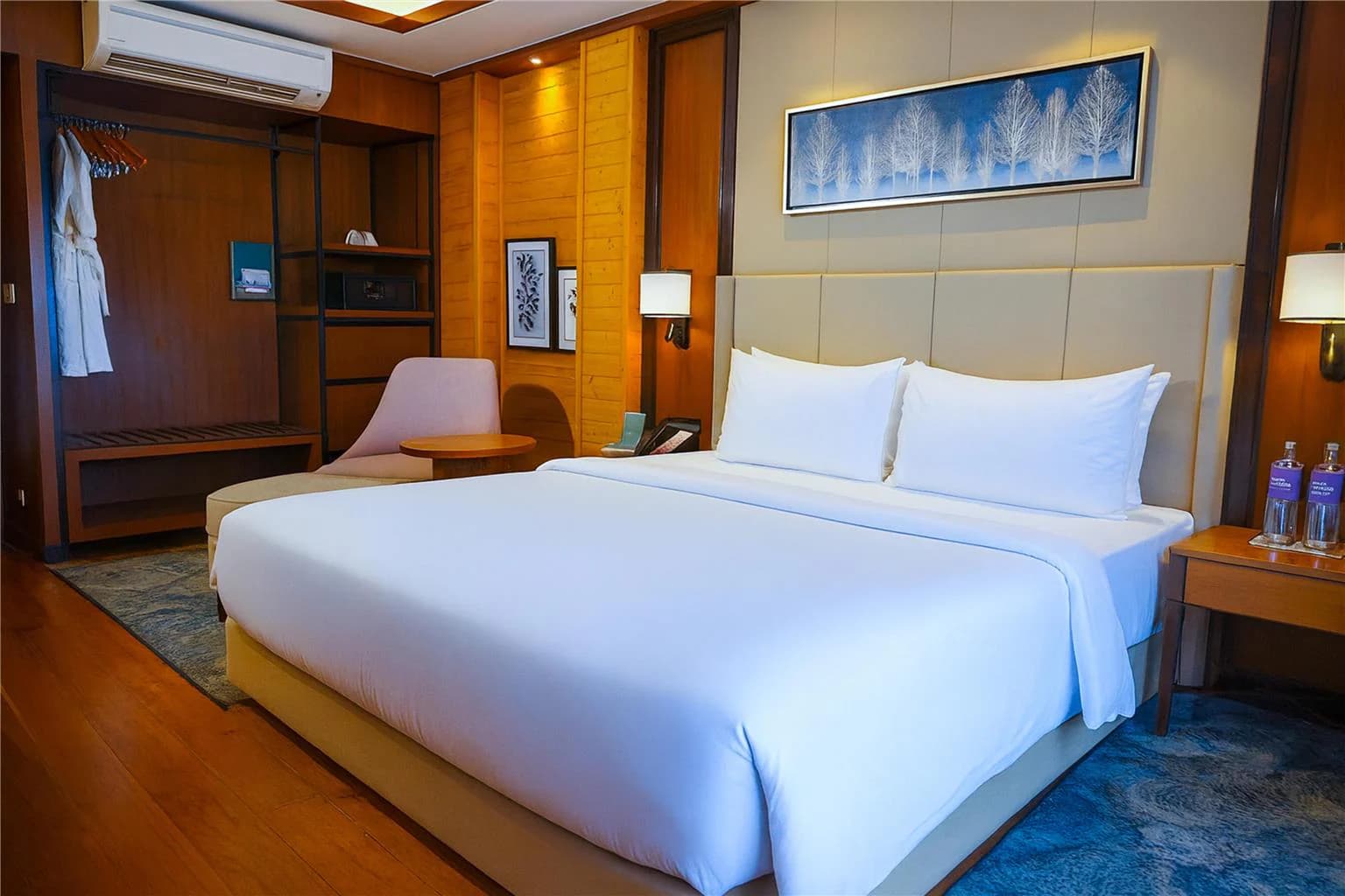 Guest room with king bed and wardrobe at Radisson Blu Resort Dharamshala