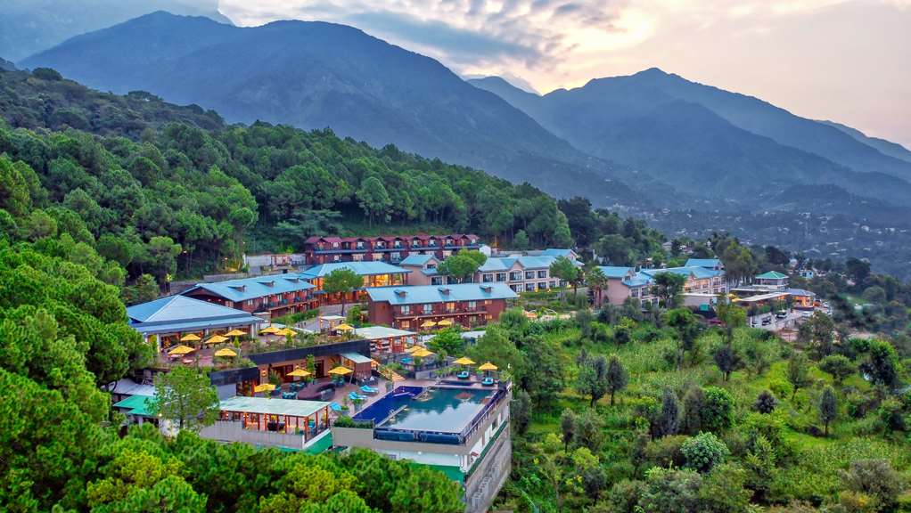 Aerial view of Radisson Blu Resort Dharamshala with its pool and the Dhauladhar range