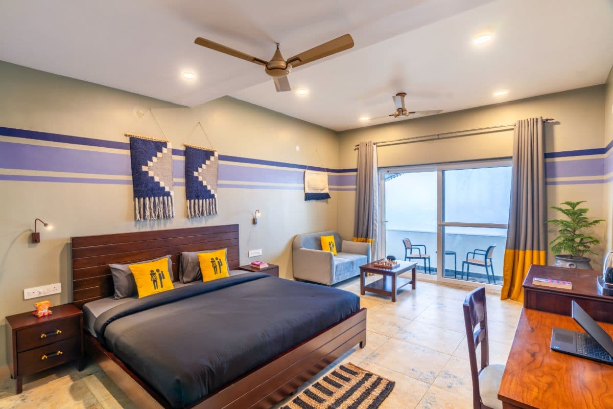 Private double room with sofa and balcony at The Hosteller Dharamshala