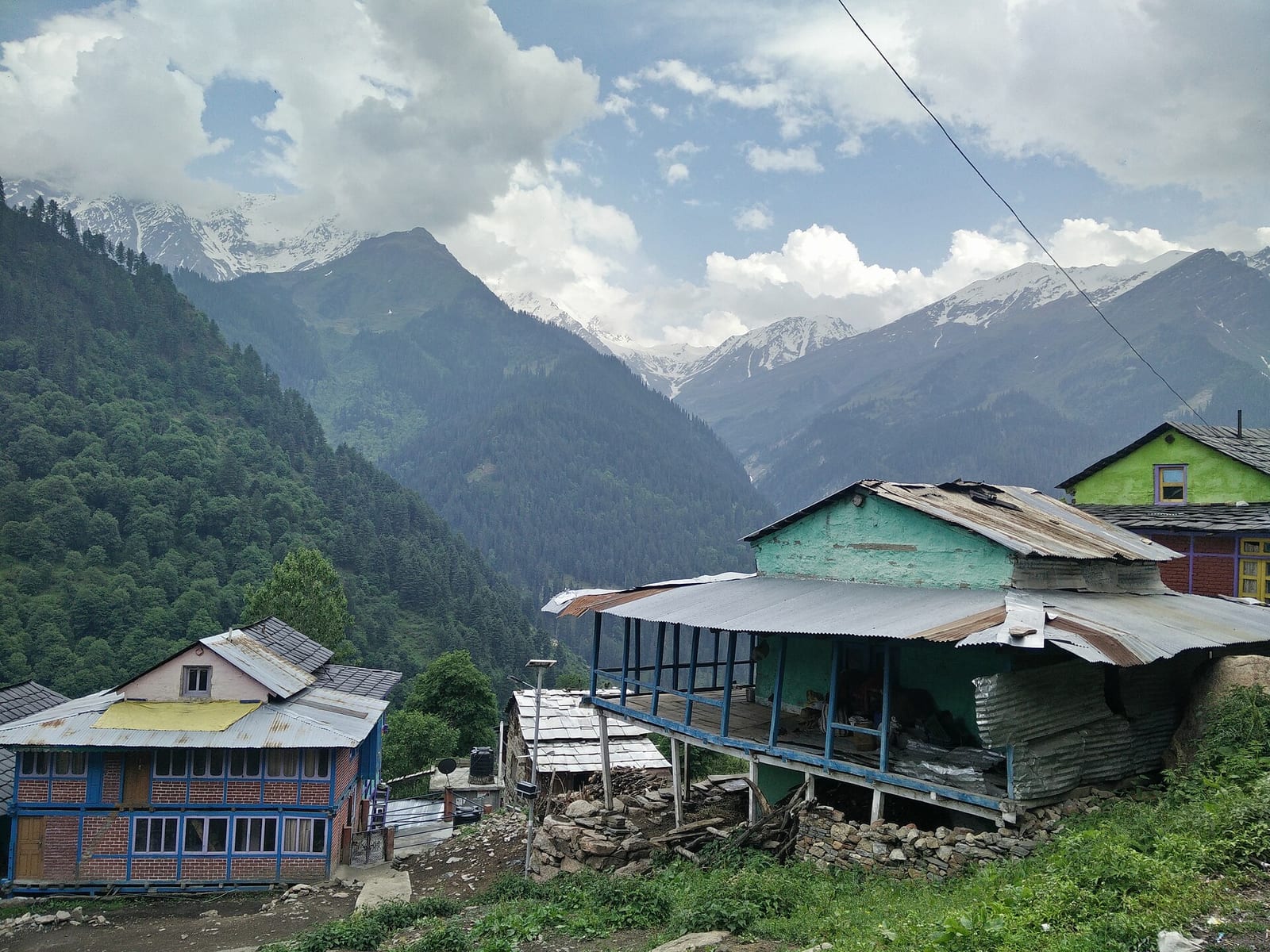 Tosh village on a mountain slope in the upper Parvati Valley, Kullu district